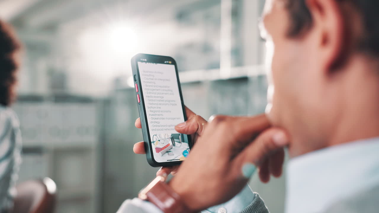 Person using a smartphone with business information