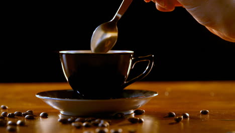 stirring coffee with spoon 4k