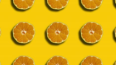 patrón mandarín en cuadrícula geométrica en un fondo amarillo. gráficos de movimiento sin costuras mínimos animación de frutas de la naturaleza