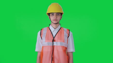 indian female architect staring to the camera green screen