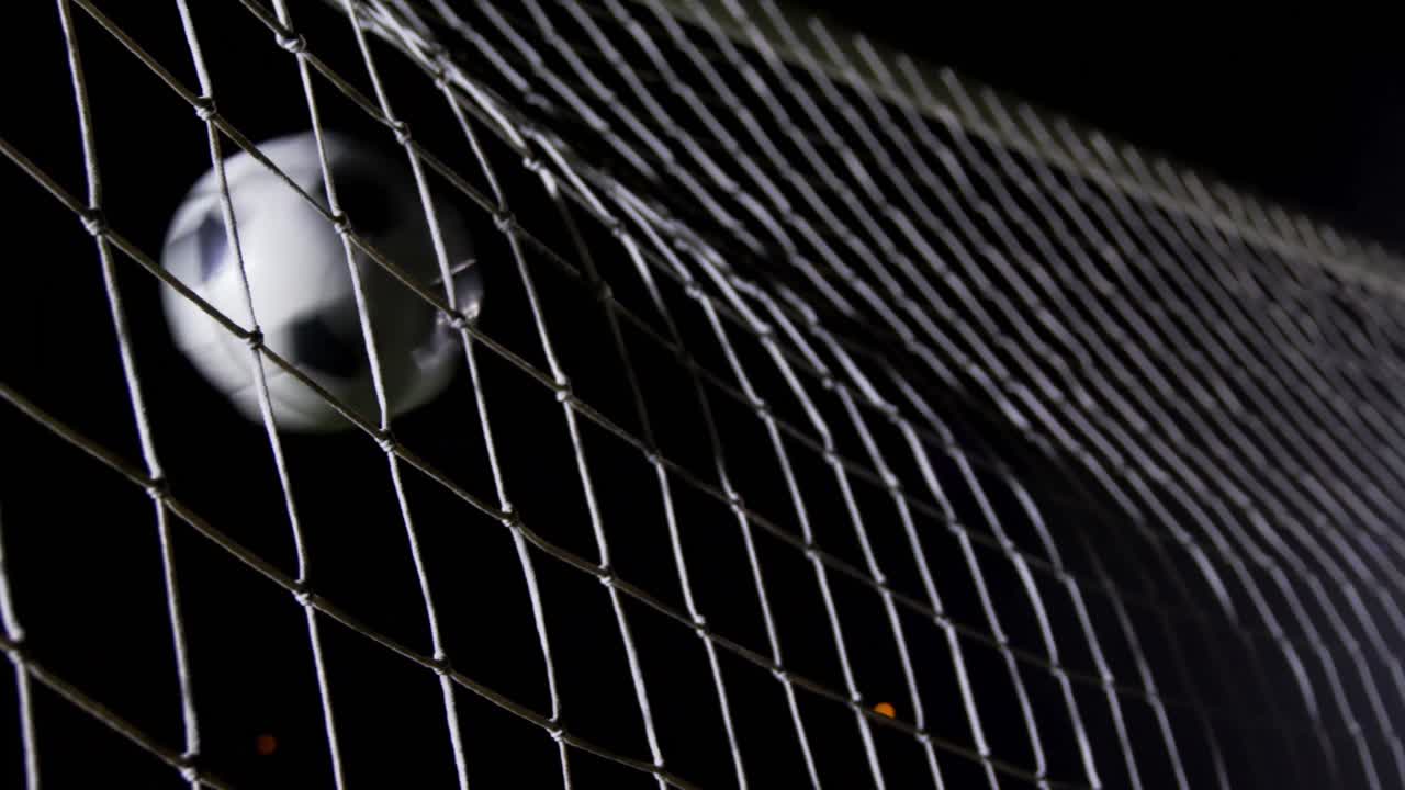 Soccer ball in goal post against goalkeeper 4k