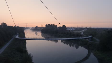 germany - bike ride on bridge path over rhine-herne canal, aerial establishing drone view