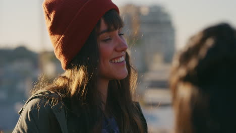 beautiful caucasian woman chatting hanging out on rooftop enjoying relaxed sunny weekend gathering socializing with friends