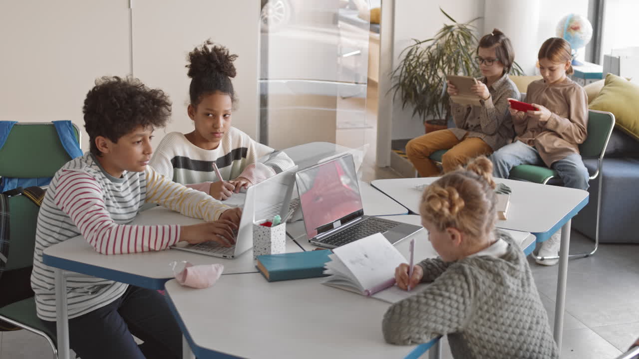 Schoolchildren Studying in Modern Classroom