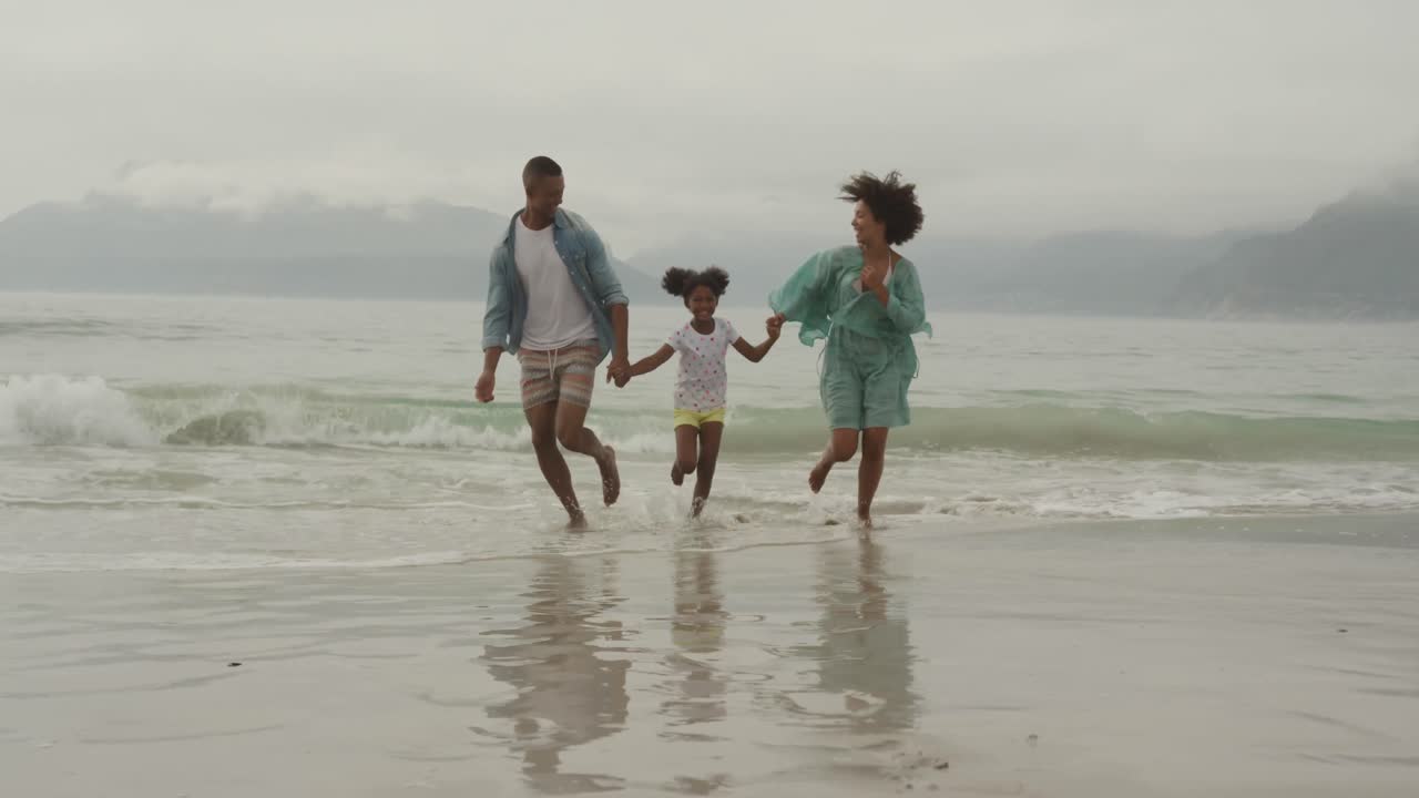 Family enjoying free time by the sea