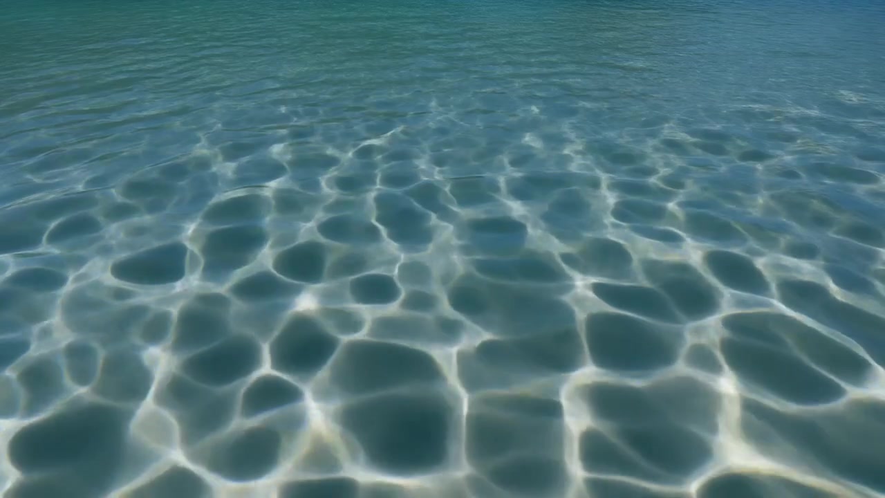 Sunlight Refraction Patterns on Shallow Sandy Sea Floor