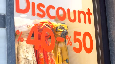 store window display with 40%-50% discount sign