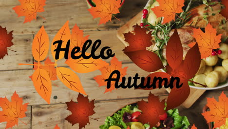 animation of hello autumn text over dinner and autumn leaves over wooden background