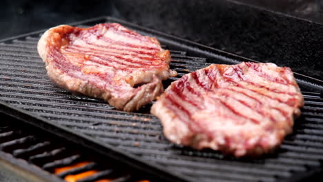 Hot-smoking-slice-of-red-meat-beef-on-the-grill