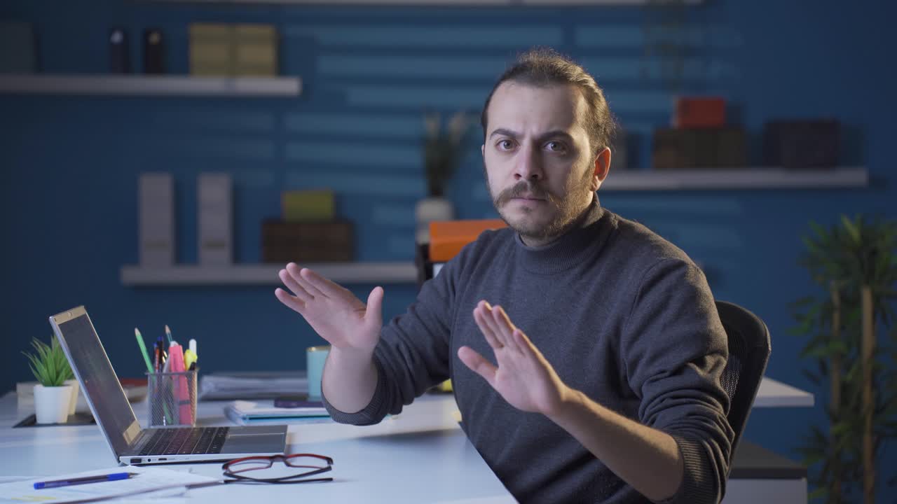 Nervous and serious businessman saying to camera NEVER, NO.