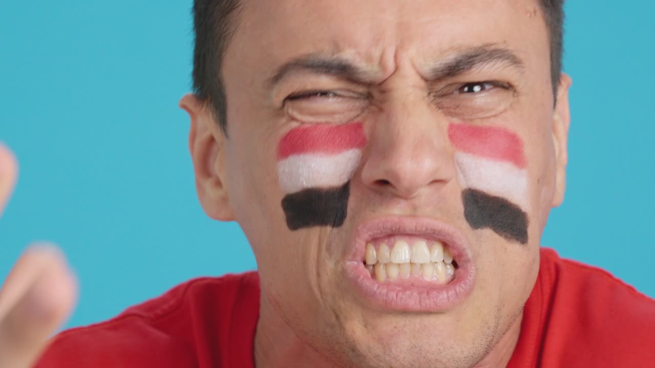 Man with egyptian national flag upset with a referee