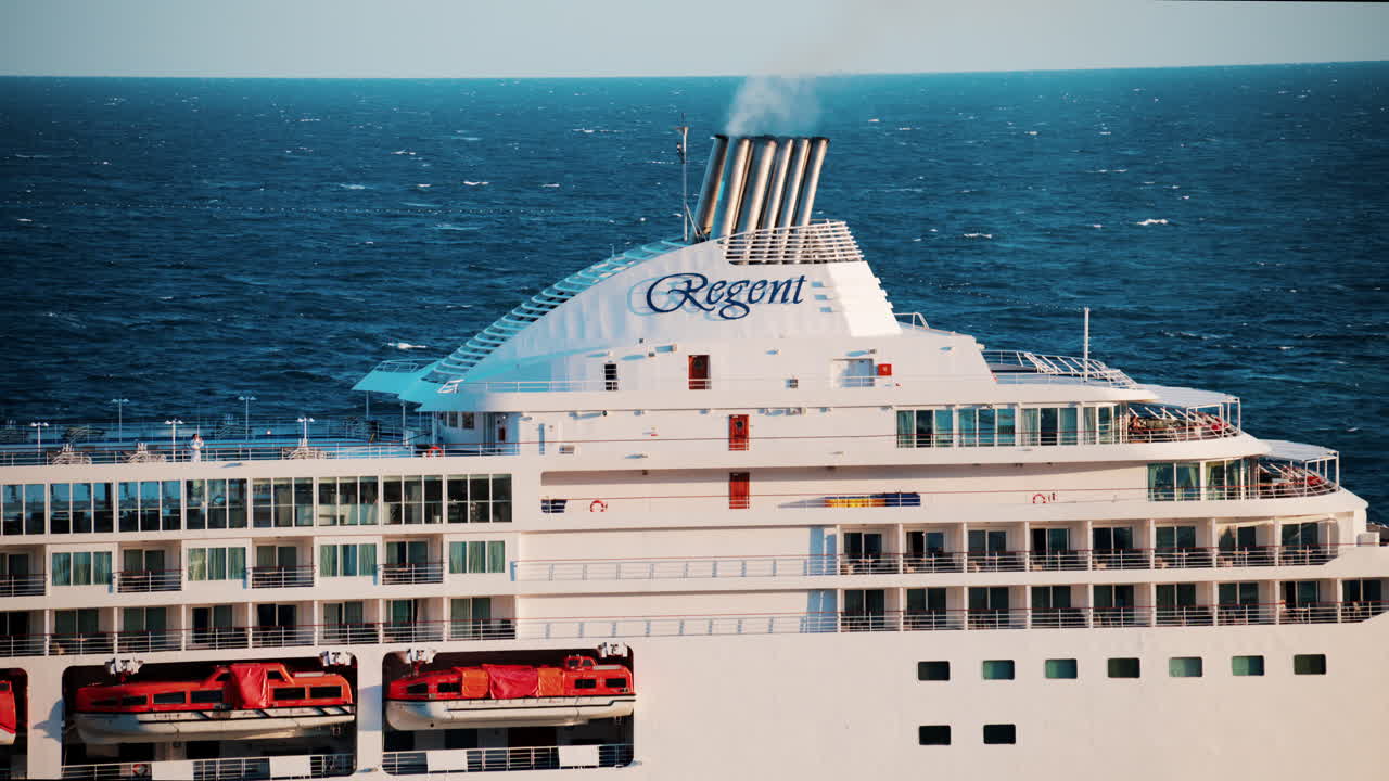 Monte Carlo, Monaco - October 14, 2024: Large cruise ship docked in the Monaco Marina in the evening