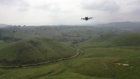 aerial view of drone flying through mountains