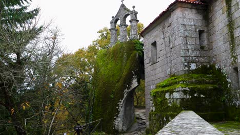 mossy rupestre church bell tower, esgos, spain