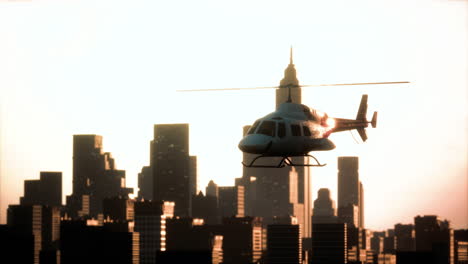 Silhouette-helicopter-at-city-scape-background