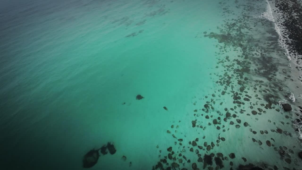 Cinematic FPV drone shot stabilized from lofoten flying over the arctic shore ascending quickly