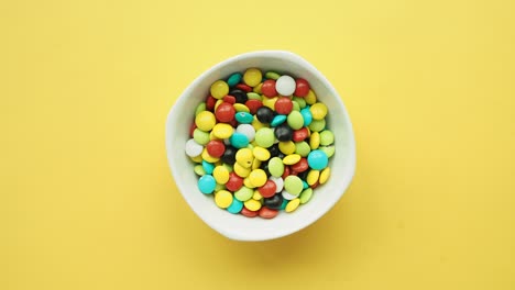 colorful candies in a white bowl