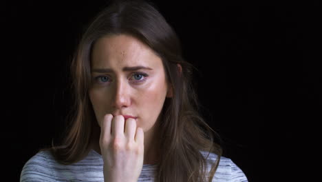 Close-Up-Of-Unhappy-Young-Woman-Looking-Sadly-Into-Camera