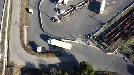 aerial view of a truck stop and railroad junction