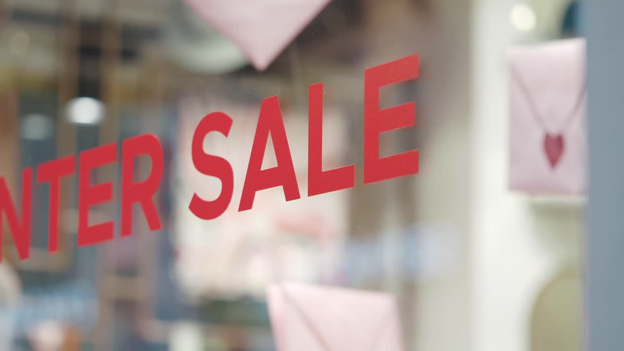 Red 'Winter Sale' Sign on Shop Window