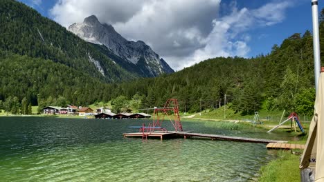 lauter lake in summer with obere wettersteinspitze mountain in the background, very close to the bavarian town of mittenwald in germany