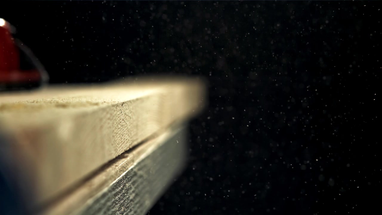 Slow Motion Dust Particles Floating Above a Wooden Plank