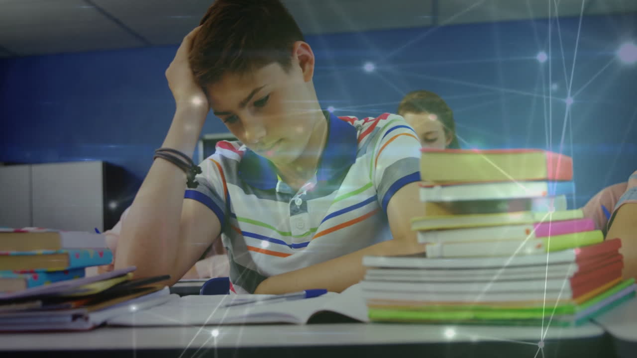 Student leaning on hand and writing at desk, showing animated pen and book stack in classroom