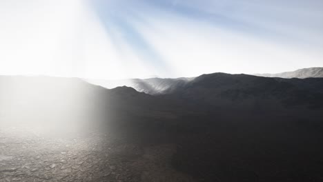 Sun-Rays-over-Mountains-in-a-Valley