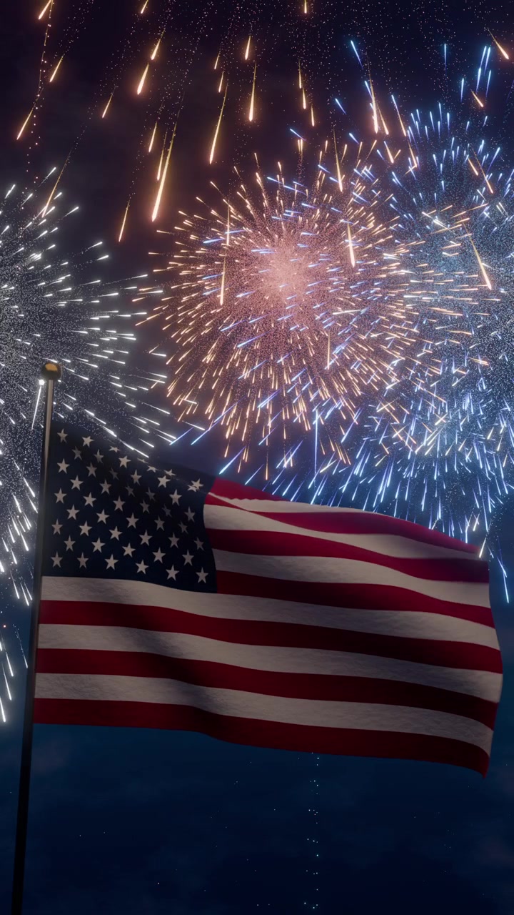 american flag fluttering in the wind against fireworks display at night sky