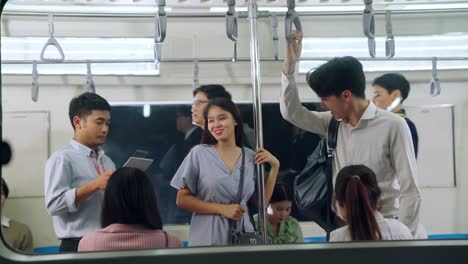 crowd of people on a busy crowded public subway train travel