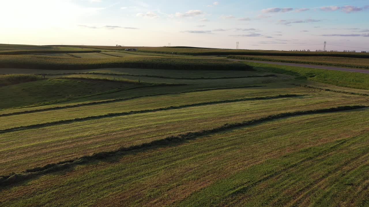Aerial View of Rural Farmland with Winding Road at Sunset