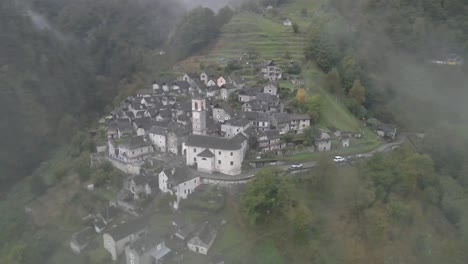 foggy aerial view of the town of corippo, valle verzasca in ticino, switzerland.