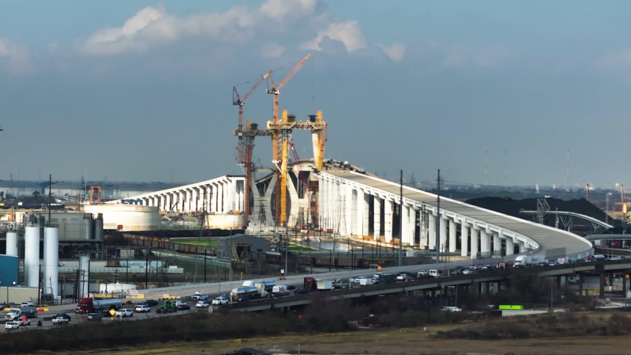 Telephoto drone shot approaching the Beltway 8 bridge, sunset in Houston, USA