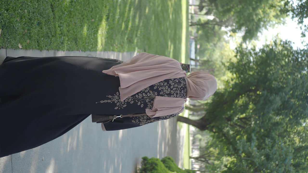 Woman in Hijab Walking in Park