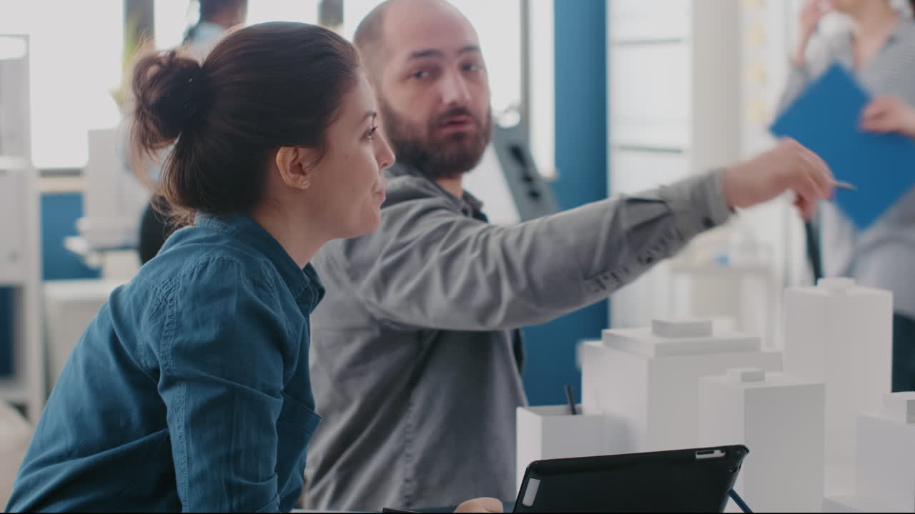 Architects collaborating on building design project