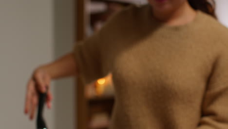 close up of woman at home in kitchen preparing healthy vegetarian or vegan meal putting sliced tofu on board into pan 1