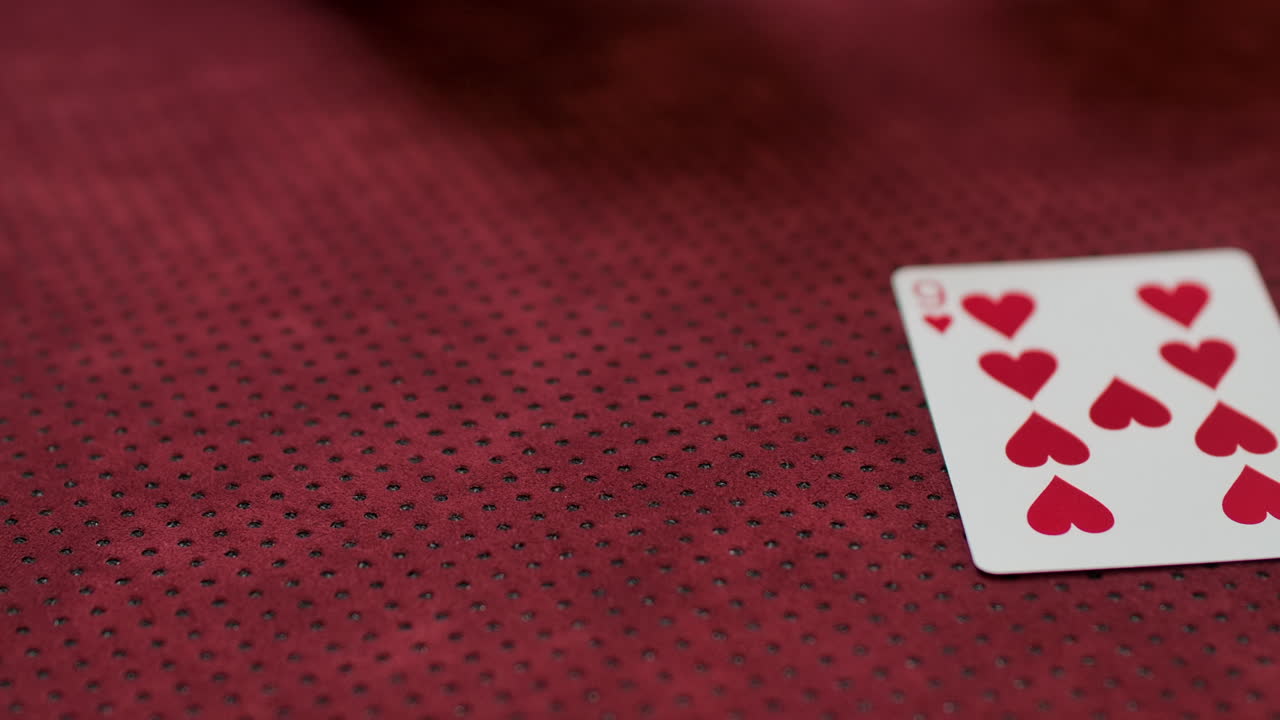 Slow motion closeup of a cards dealt in a poker game