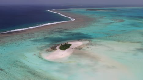 aerial fly-over of expansive shallow coral reef system in kingdom of tonga