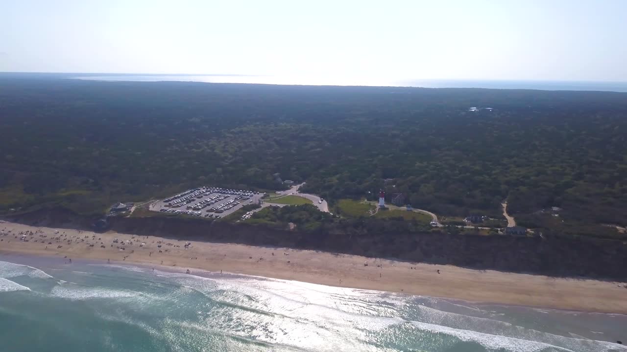 Bird's Eye View Of Nauset Beach And Lighthouse By Blue Sea With Sparkling Water In Eastham, Massachusetts. - aerial