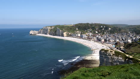 panorama drone shot of sandy beach and famous sea cliffs in etretat during summer day