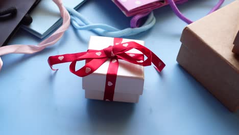 gift box with ribbon and shopping bags