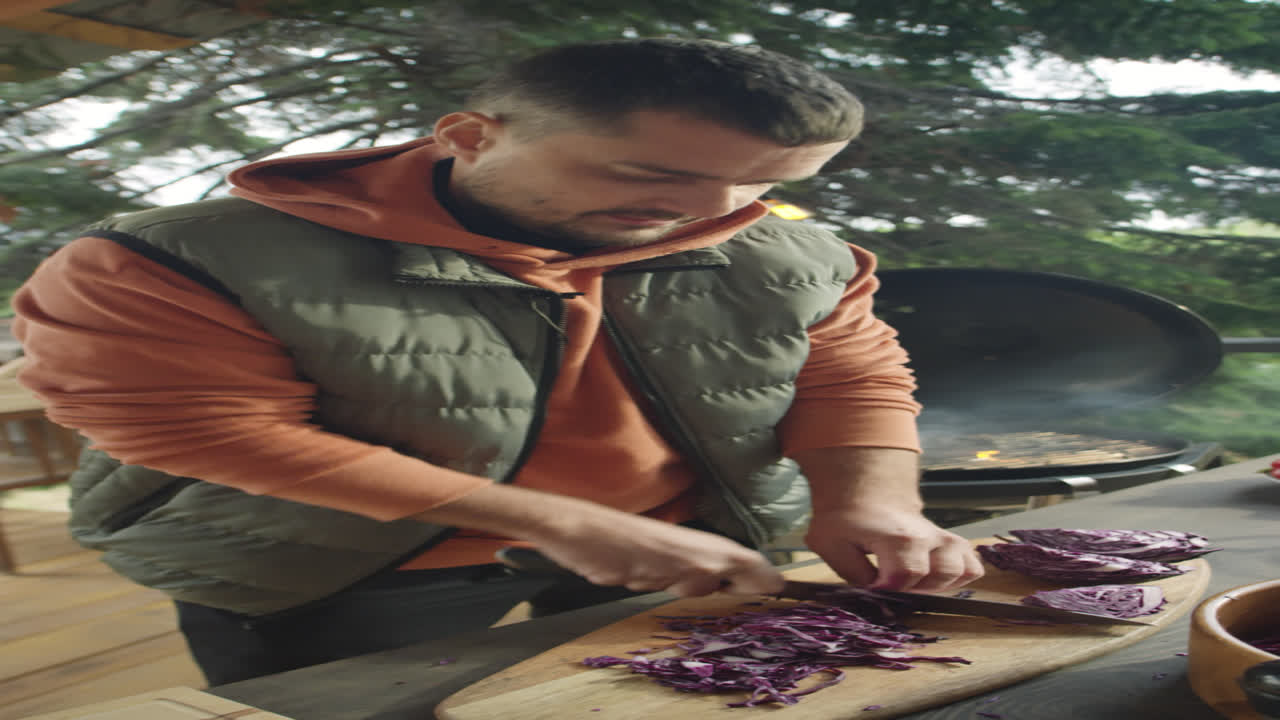 Food Blogger Shredding Cabbage and Talking on Camera