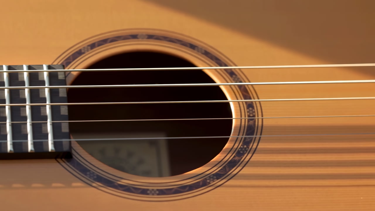 Sunlit Acoustic Guitar Closeup Shows Warm Spruce Top, Detailed Rosette And Bridge With Steel Strings Soft