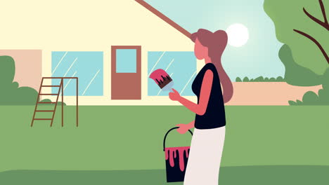 mujer pintando el exterior de la casa en su patio trasero