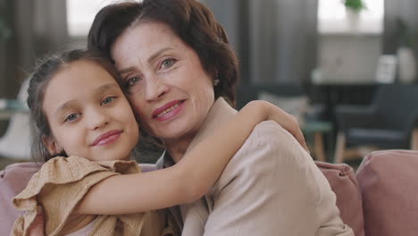 grandmother and granddaughter hugging