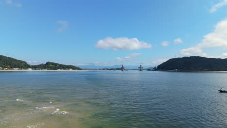 far shot of ponte de guaratuba-matinhos bridge construction over water, showing structure and surroundings