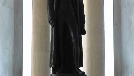 a statue of thomas jefferson is seen standing inside the jefferson memorial building 1