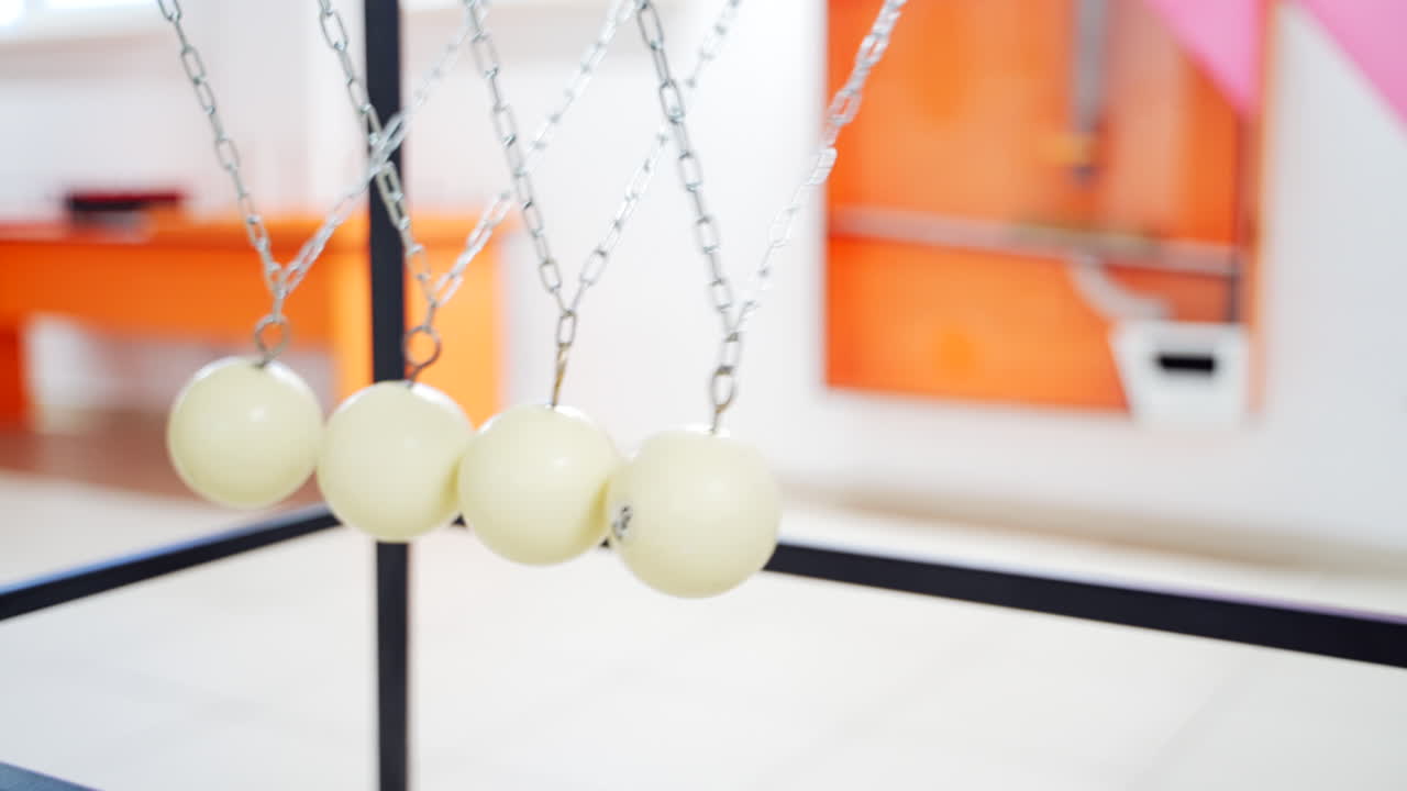 Balancing balls of Newton's cradle. Museum of Science