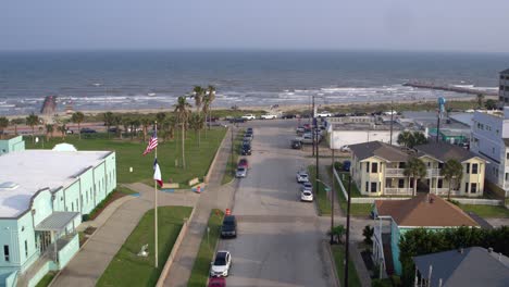 Drone-view-of-the-Pleasure-Pier-and-Galveston-Beach-in-Galveston,-Texas