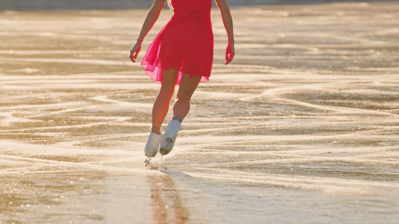 Woman ice skating on frozen lake